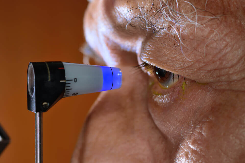 Closeup of older man getting an eye exam