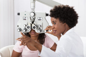 eye doctor performing eye exam
